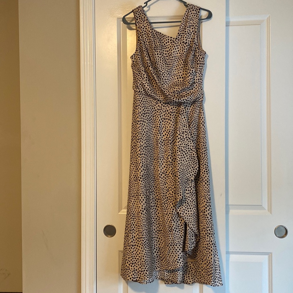 Asymmetrical polka dot tea length dress.